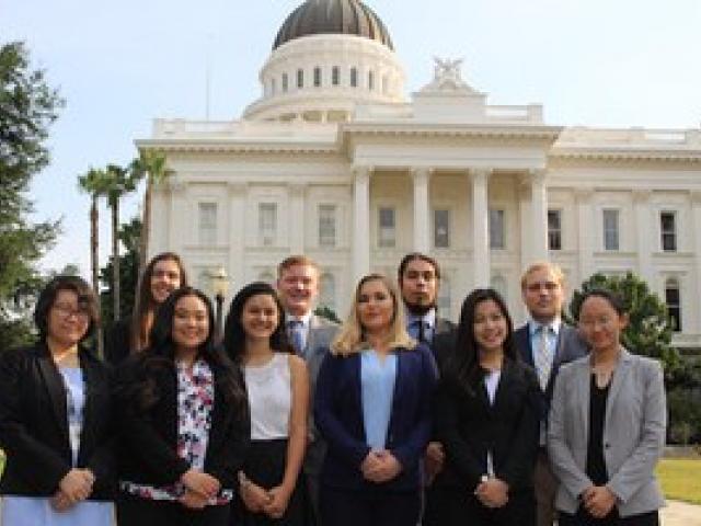 group of business students standing outside capitol building, sacramento