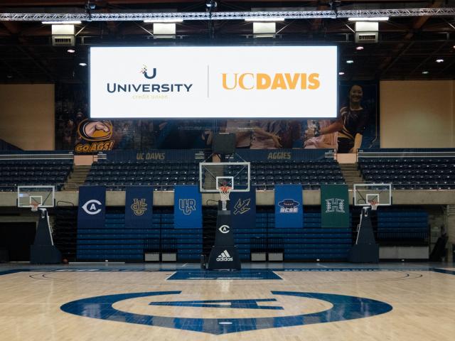 Photo of scoreboard displaying UCU and UC Davis.