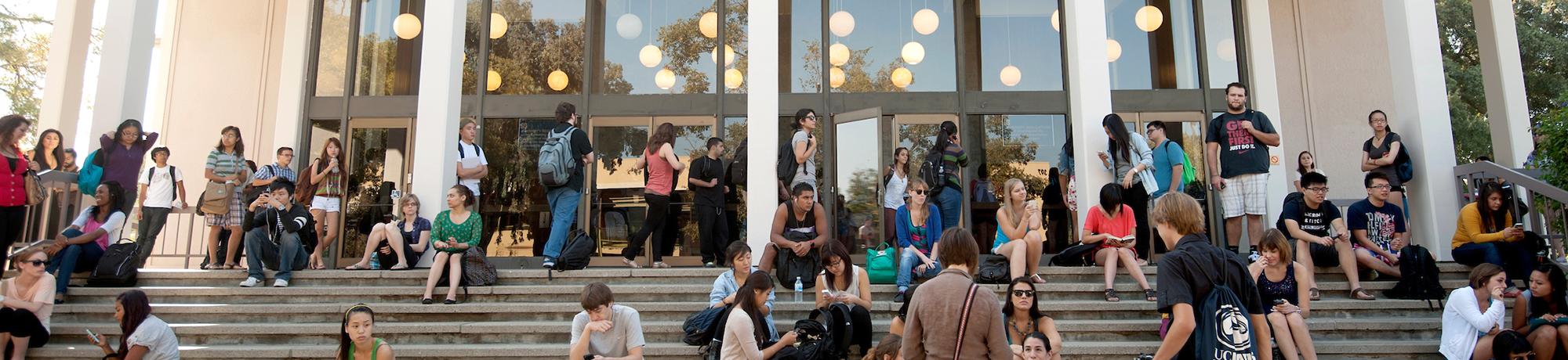 group of uc davis students waiting outside lecture hall